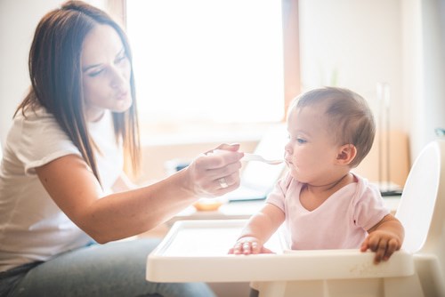 Mother feeding child