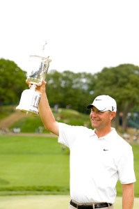 Lucas Glover holding his U.S. Open trophy at Behtpage Black